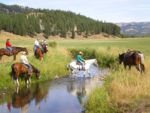 horseback riding crossing the SanPoil River